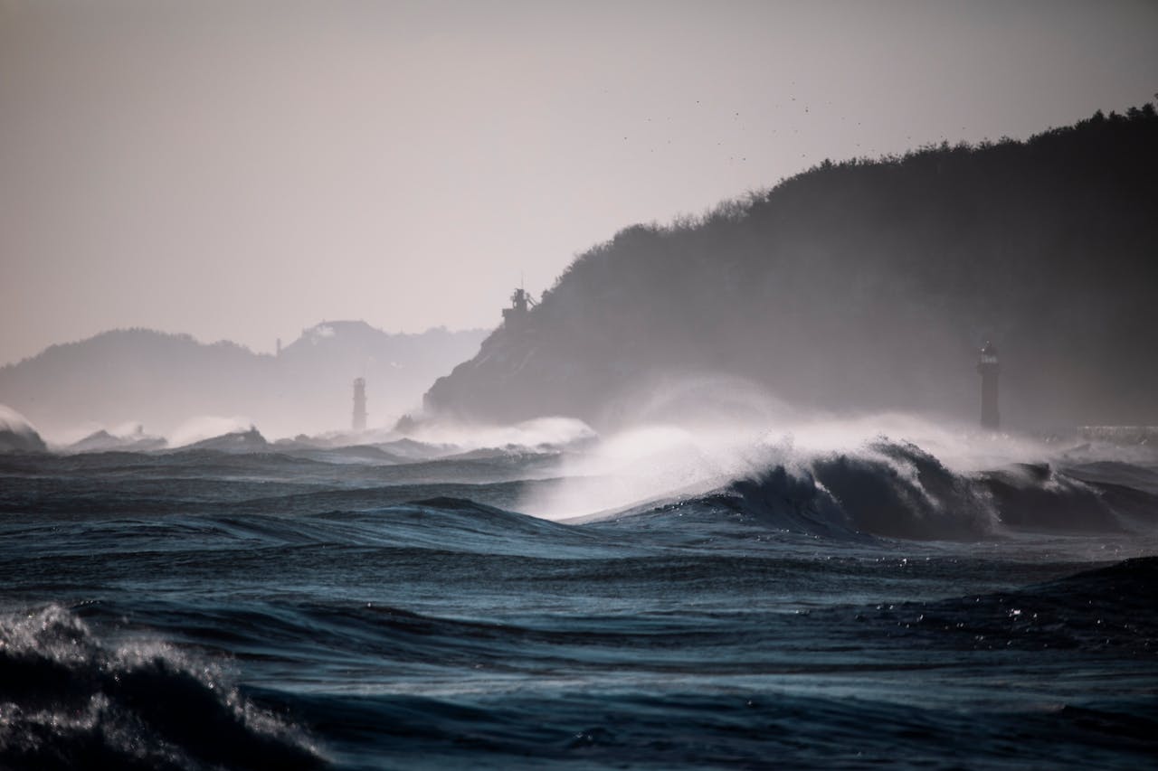 Powerful waves crash against the coast near a lighthouse at Yangyang, South Korea.